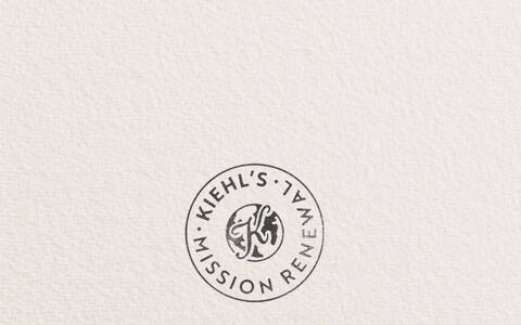 Kiehl’s Mission Renewal banner featuring a circular stamp logo and text reading, "Our imperfect journey to drive a more circular economy," promoting the brand's sustainability and circular economy initiative.