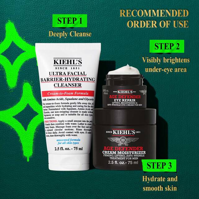 A graphic, set against a dark green textured background with bright green accents, features the text "RECOMMENDED ORDER OF USE" at the top right. Below, three Kiehl’s products are arranged. On the left is a white tube of "KIEHL’S ULTRA FACIAL BARRIER-HYDRATING CLEANSER," which is labeled "STEP 1 Deeply Cleanse." Stacked on the right are a black jar of "KIEHL’S AGE DEFENDER EYE REPAIR" with visible cream, labeled "STEP 2 Visibly brightens under-eye area," and a larger black jar of "KIEHL’S AGE DEFENDER CREAM MOISTURIZER," labeled "STEP 3 Hydrate and smooth skin." Bright green graphic shapes are present on the left side of the image.