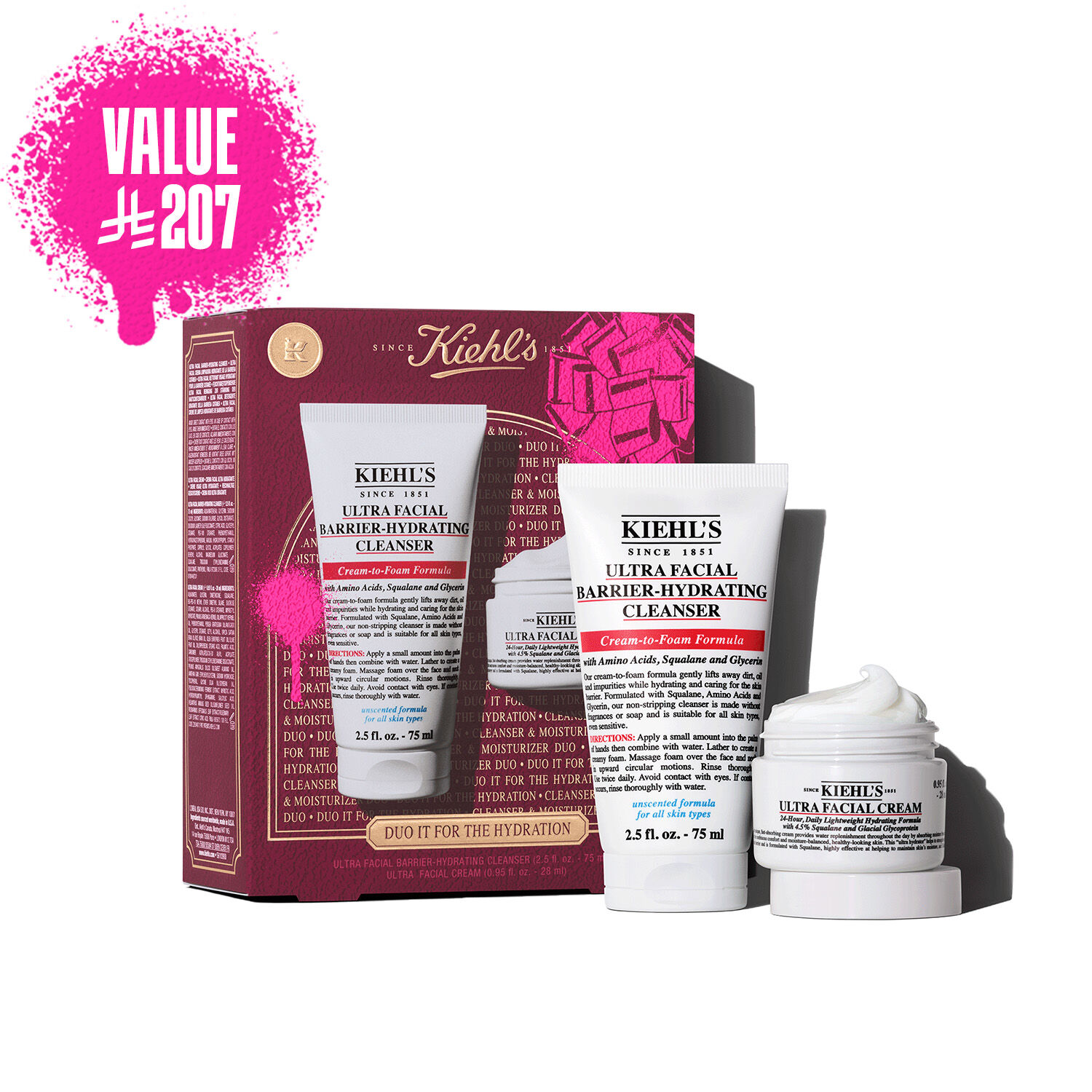 A graphic displays a Kiehl's gift set box, primarily in dark red, featuring a pink bow graphic in the upper right and a pink paint splatter in the lower left. The box states "DUO IT FOR THE HYDRATION" on its front, along with "ULTRA FACIAL BARRIER-HYDRATING CLENSER + ULTRA FACIAL CREAM. To the right of the box, the two products are shown outside their packaging.